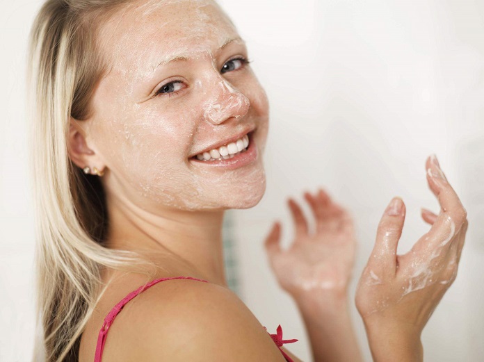girl using cleanser skin products