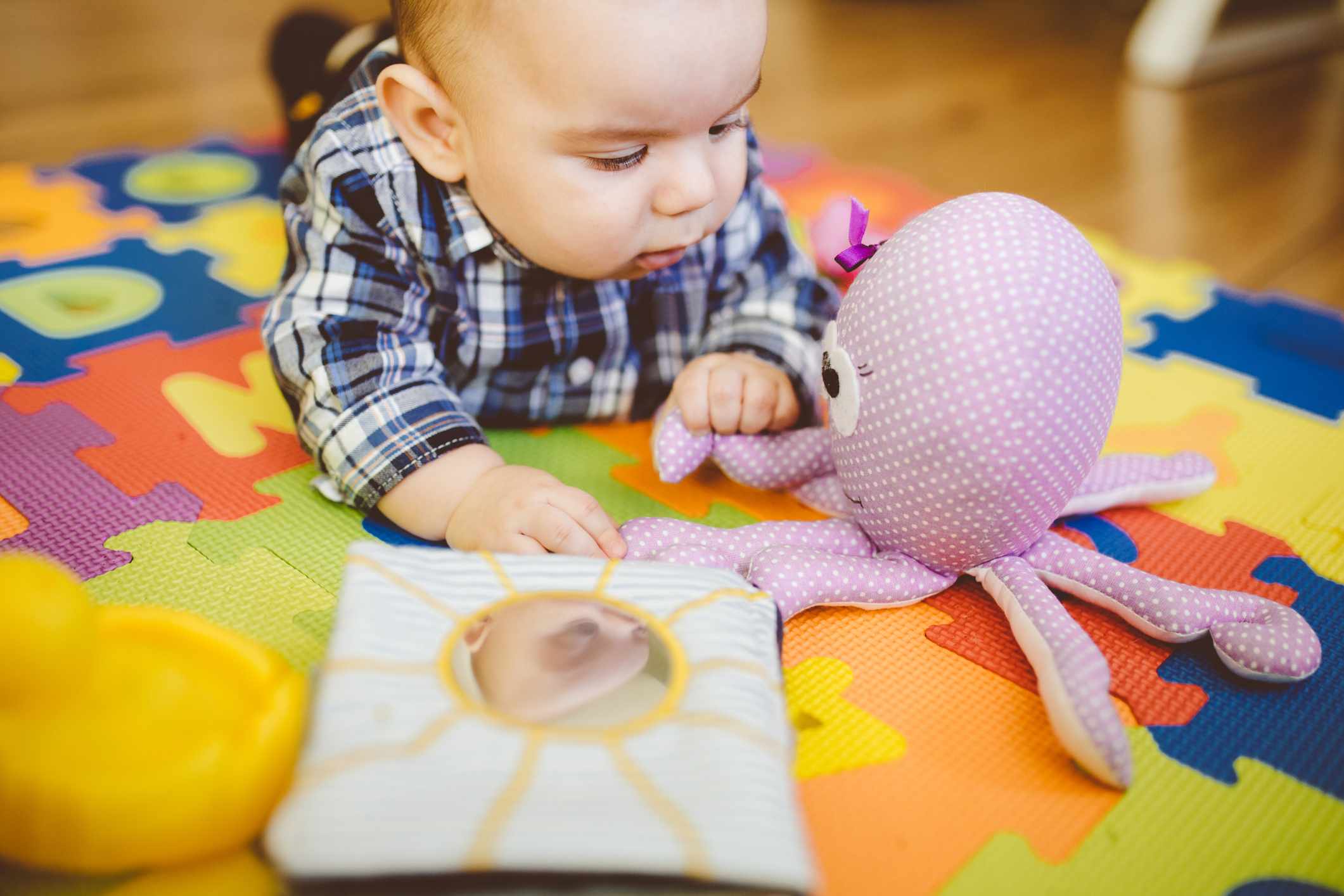 baby playing with toys for babies