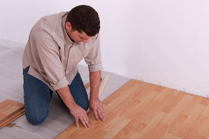 man fixing the floor