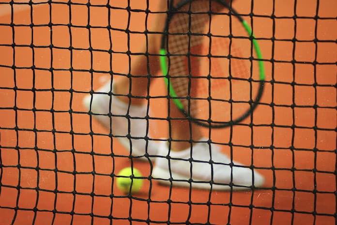 Tennis net ball and racket