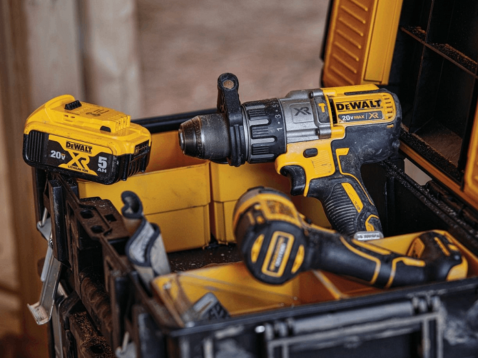 Close-up of dewalt box with drills and battery in it 