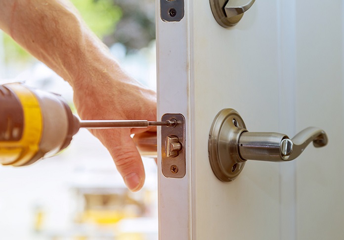 hand installing door lock close up
