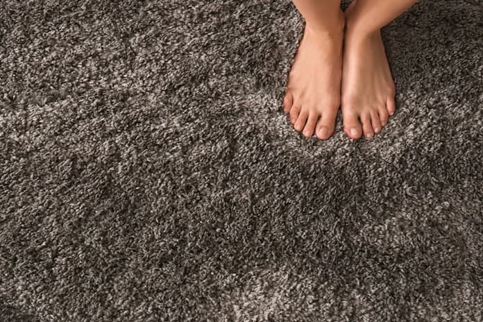 barefoot on soft nylon carpet