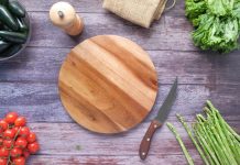 picture of vegetables beside a chopping board and a knife