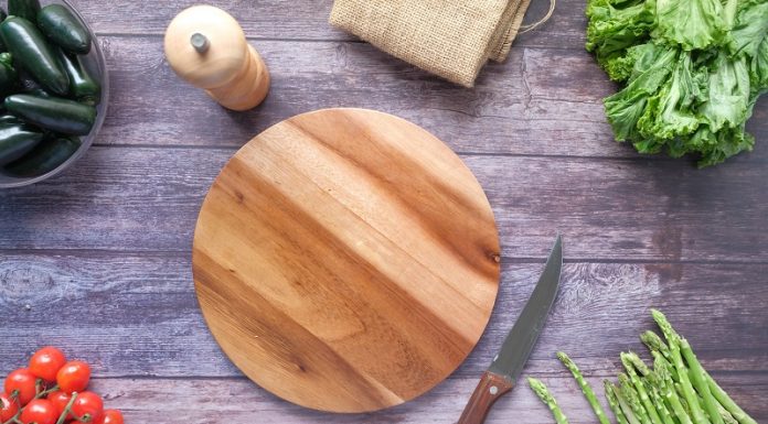 picture of vegetables beside a chopping board and a knife