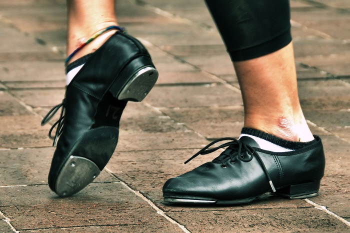 picture of Tap dancer performing outdoors in split sole tap dance shoes 