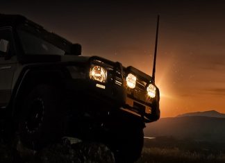 Led light on 4x4 vehicle on mountain at night