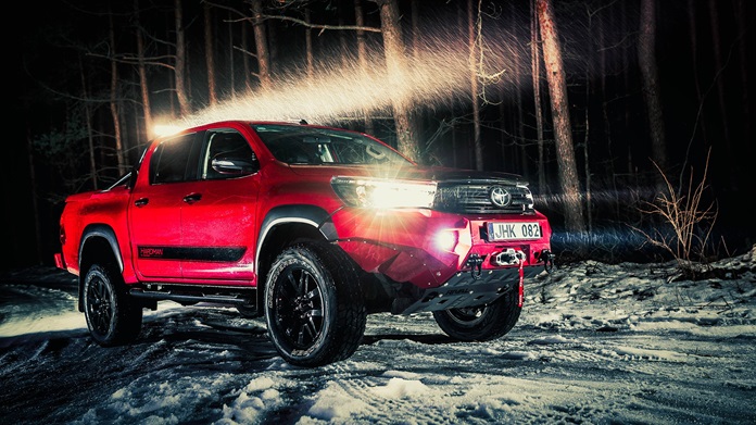 Offroading Toyota Hilux with offroad lights on