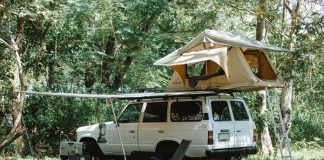 white SUV with essential camping equipment for it